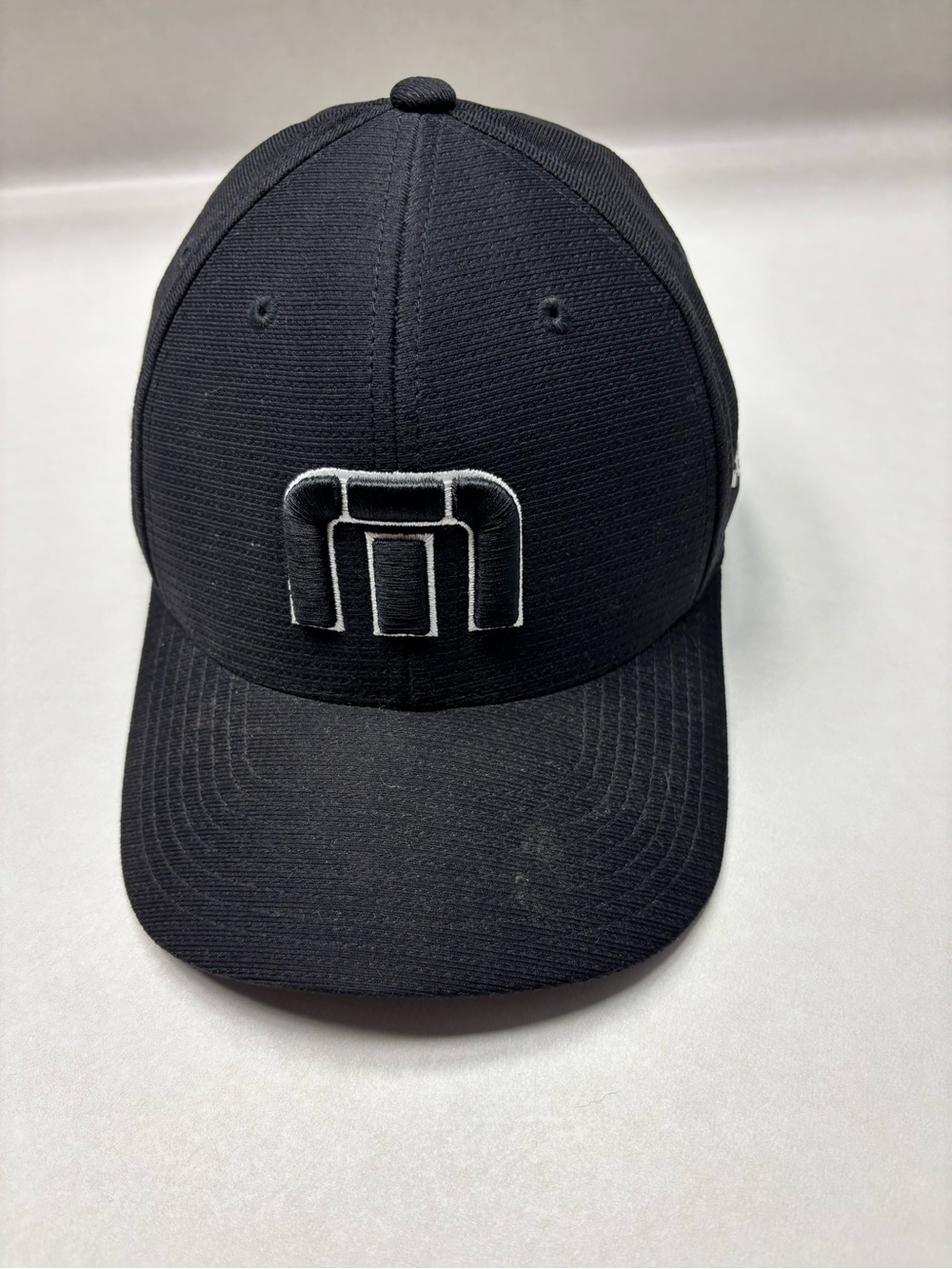 Travis Mathew Black Baseball Cap with White Logo